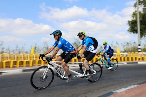 Riding past yellow chairs